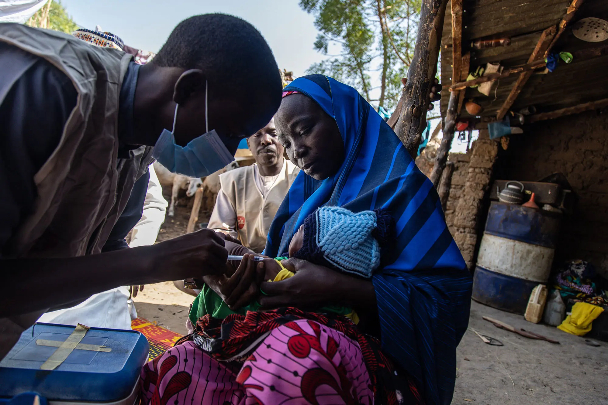 Healthworker Nura Ibrahim Administers A Vaccine To 22 Day Old Rukayya 