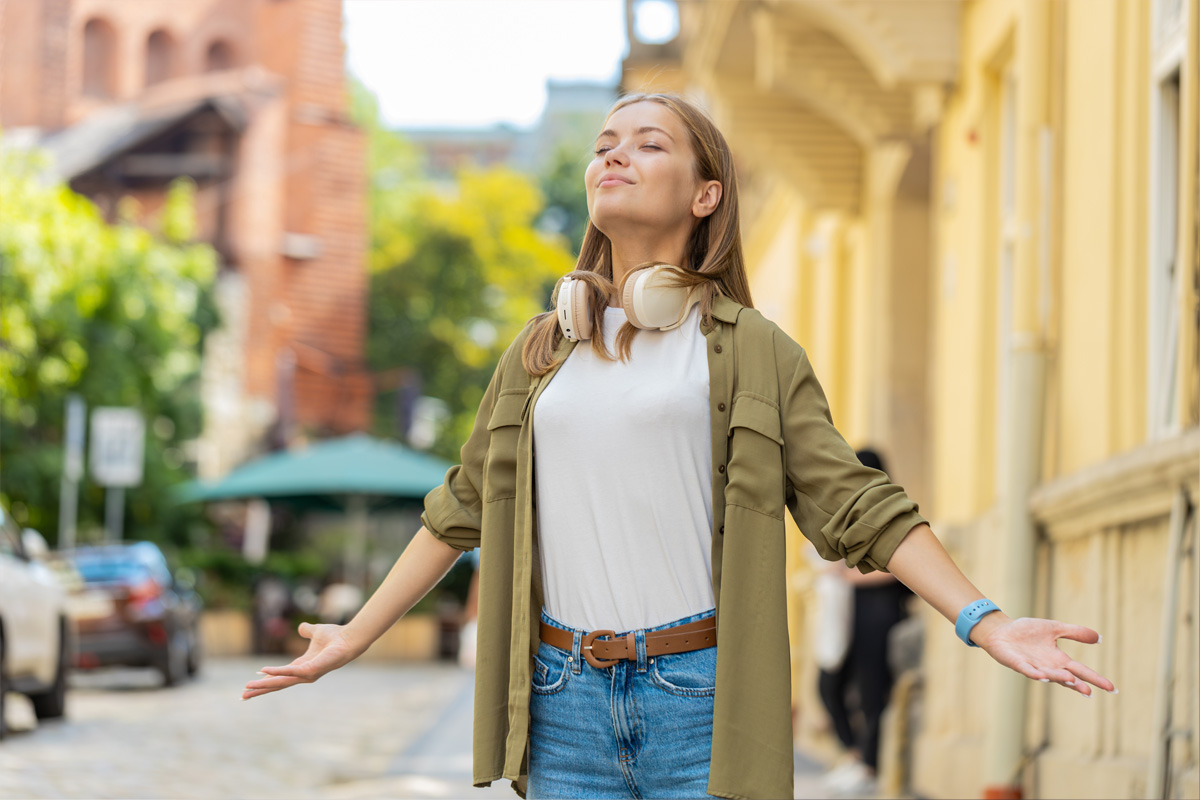 Woman taking a deep breath of fresh air
